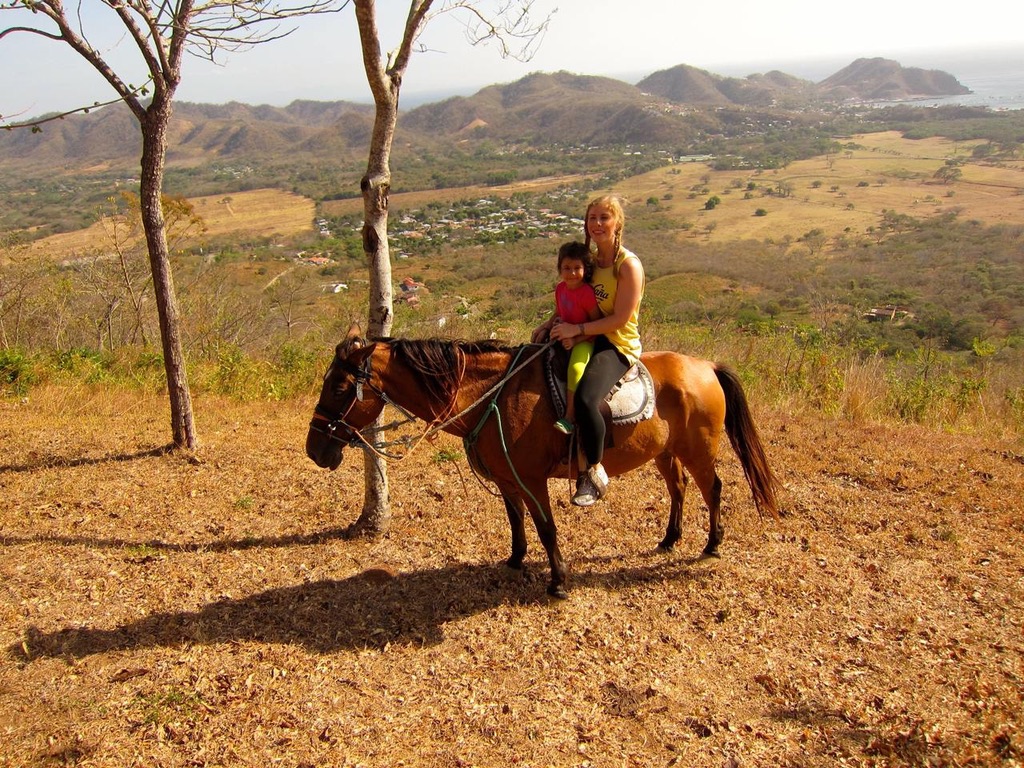 Brooke on horseback overlooking the valley