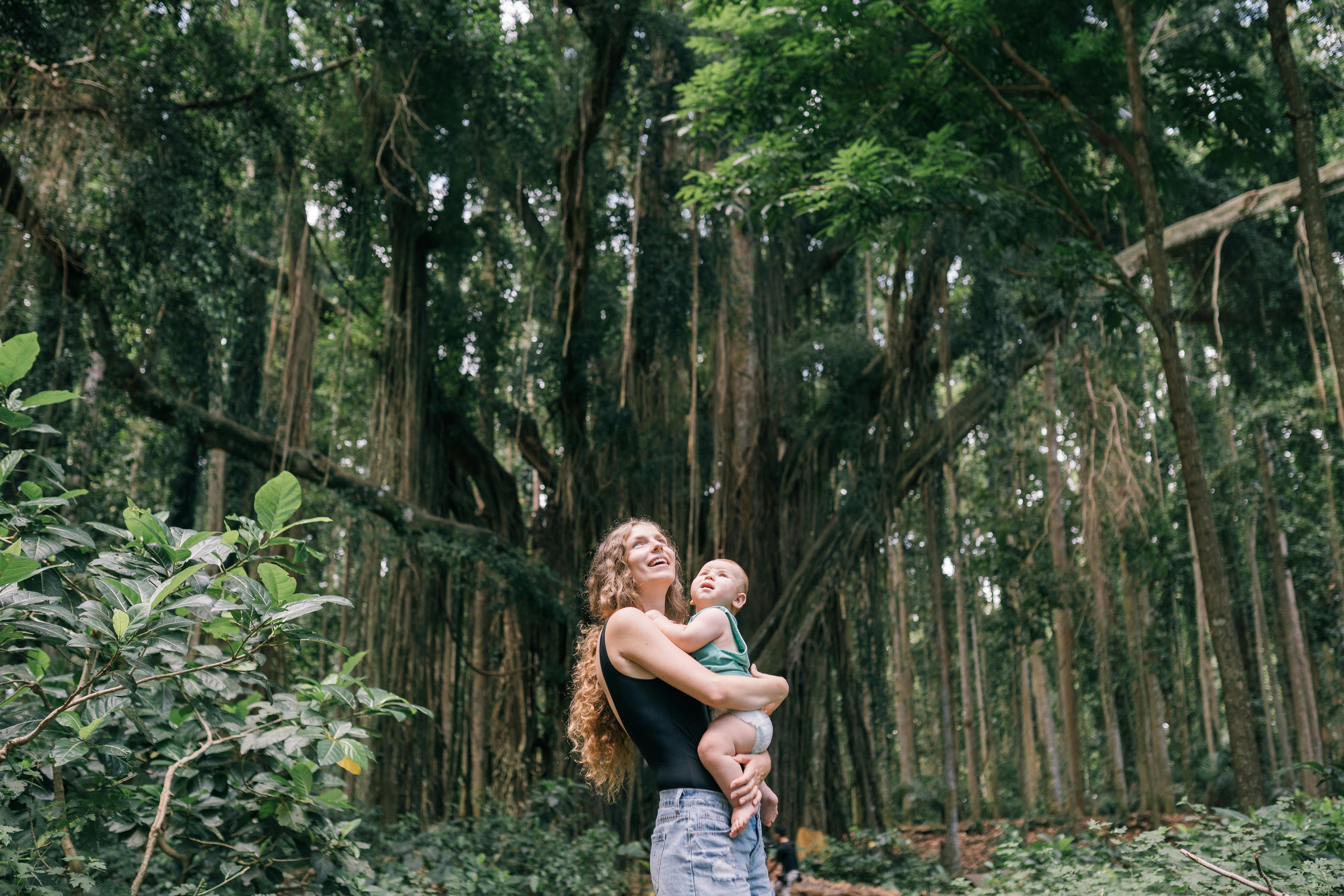 Mother and baby laughing in nature
